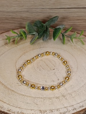 Zlatostříbrný náramek se čtyřlístkem